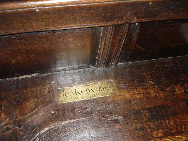 Brass plaque on pew seat